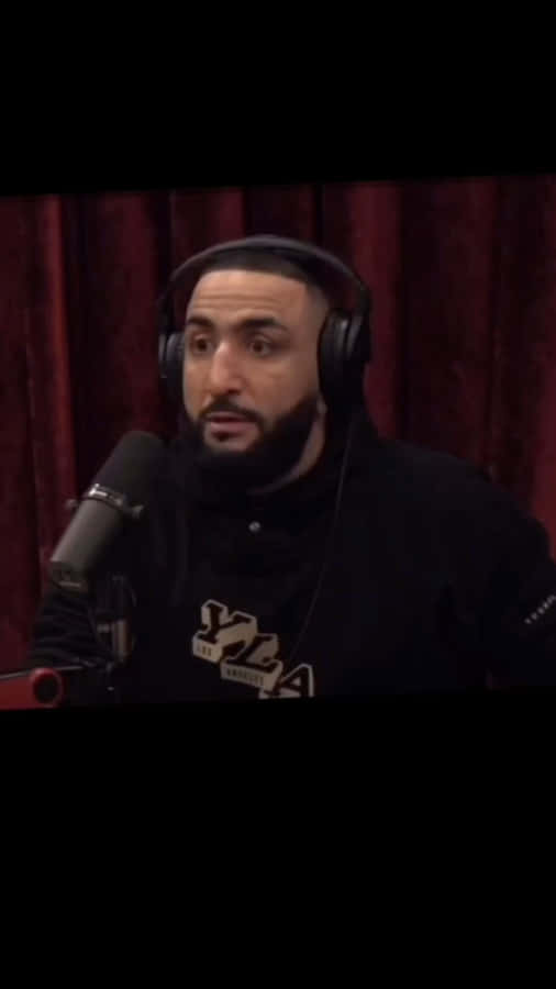 Belal Muhammad Speaking Into A Microphone Wallpaper