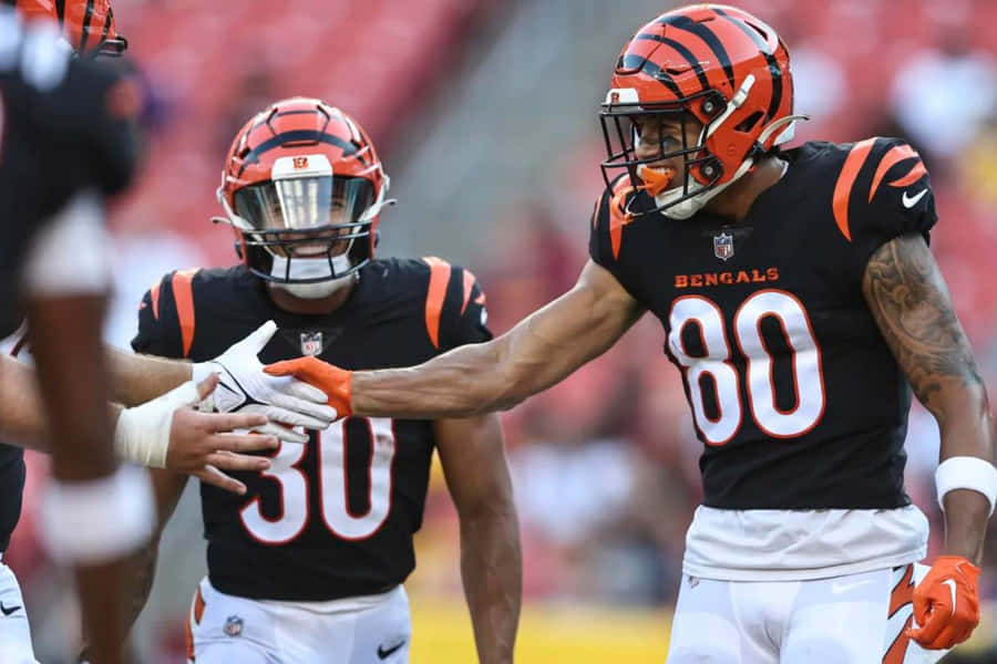 Bengals Players Celebrating On Field Wallpaper