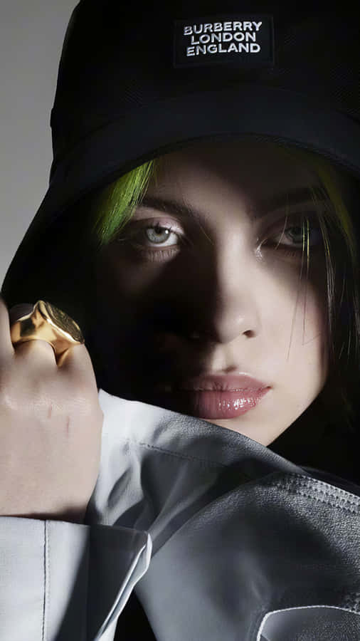 Billie Eilish Wearing A Cap Wallpaper