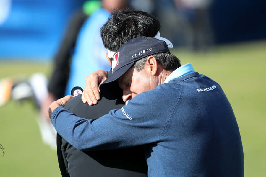 Billy Andrade Hugging Y. E. Yang Wallpaper