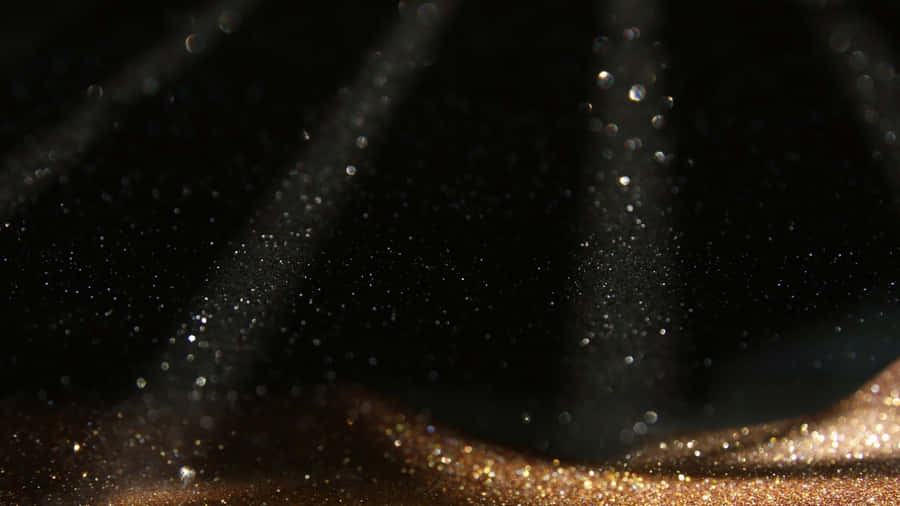 Black And Gold Glitter With Spotlights Wallpaper