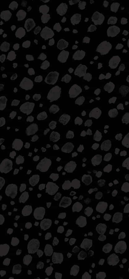 Black And White Pebbles On A Black Background Wallpaper