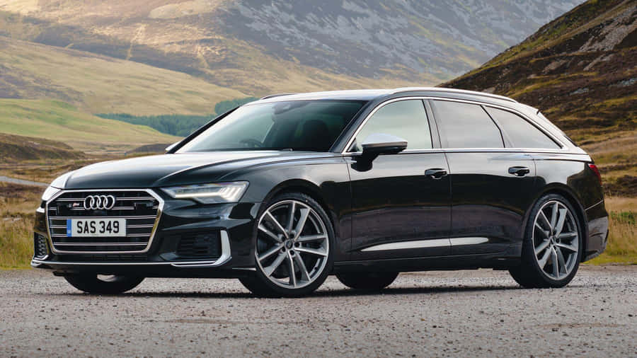 Black Audi Station Wagon Mountain Backdrop Wallpaper