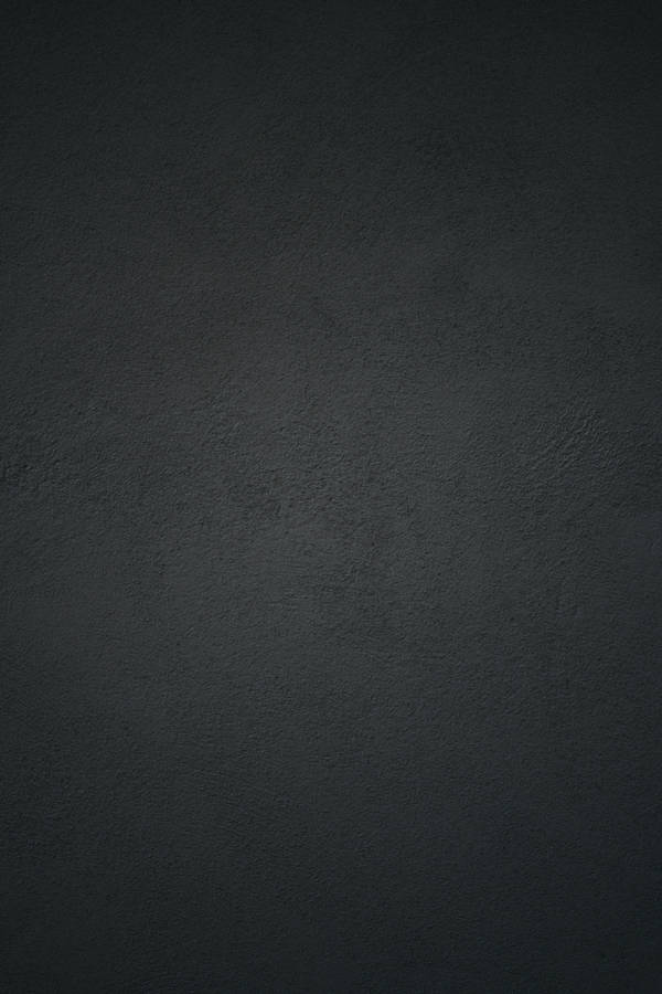 Black Concrete Wall Background With A Light Reflection Wallpaper