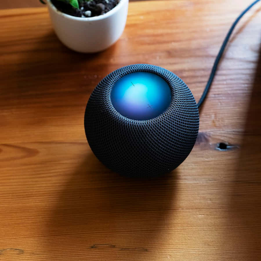 Black Homepodon Wooden Table Wallpaper