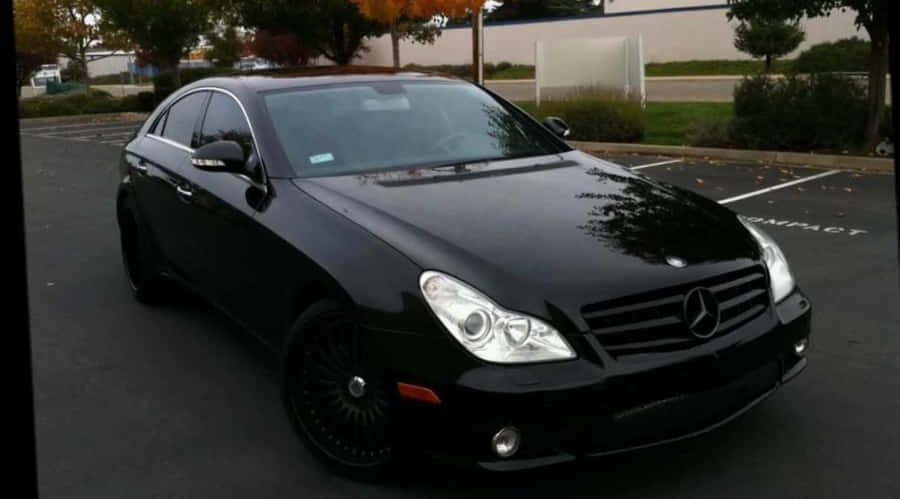 Black Luxury Sedan Parked Outdoors Wallpaper