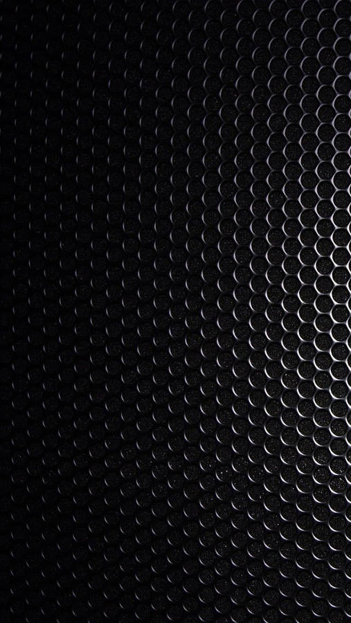 Blank Black Steel Plate With Holes Wallpaper