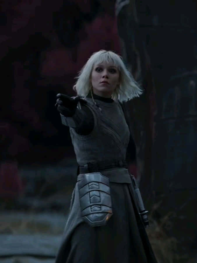 Blonde Warrior Pointing Weapon Wallpaper