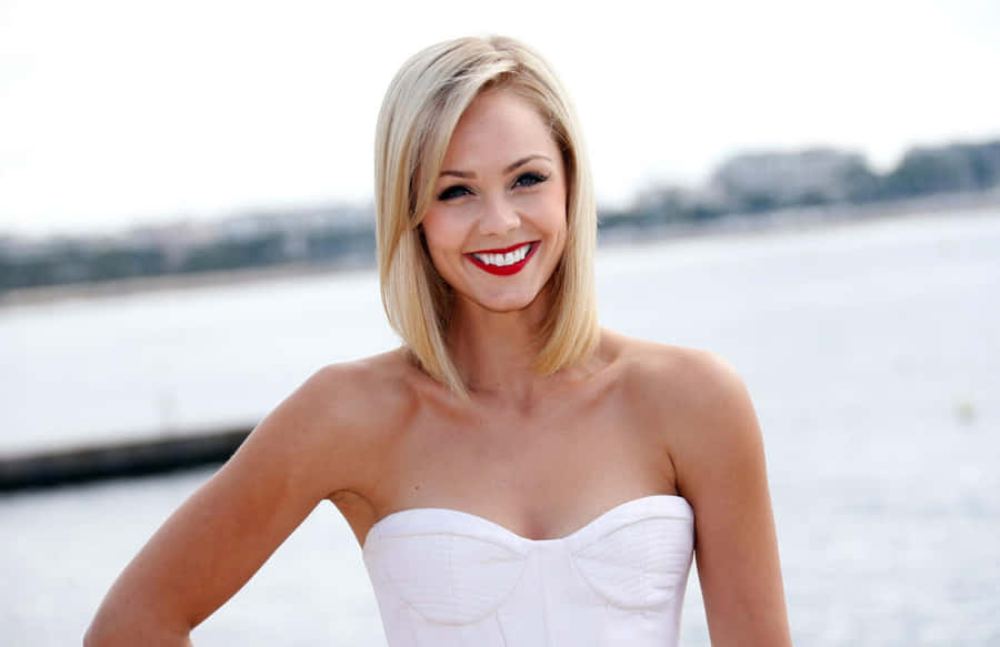 Blonde Woman Smiling Waterfront Portrait Wallpaper