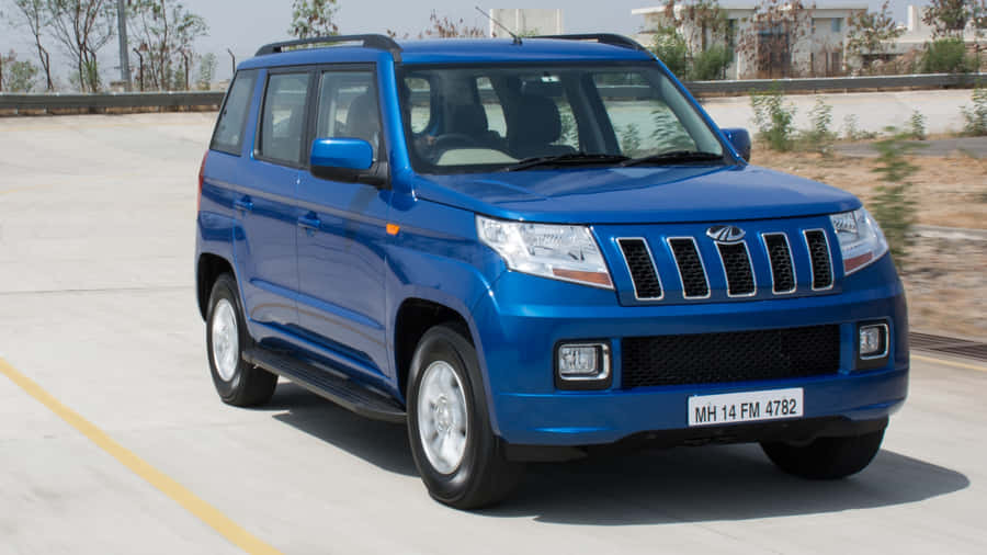Blue Mahindra T U V300 On Road Wallpaper