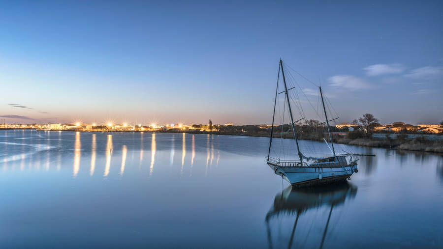 Boat Against City View Wallpaper