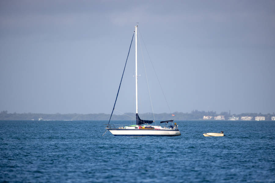 Boat On A Vast Ocean Wallpaper