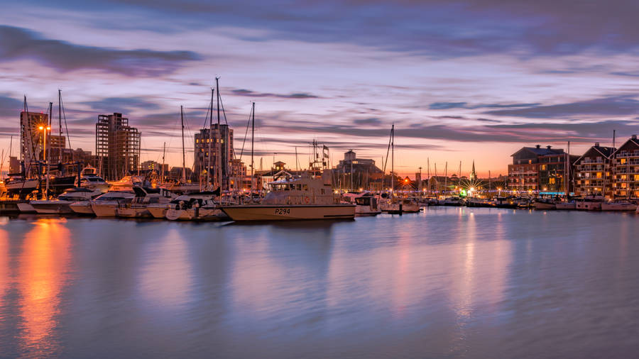 Boat On The Pier At Sunset Wallpaper