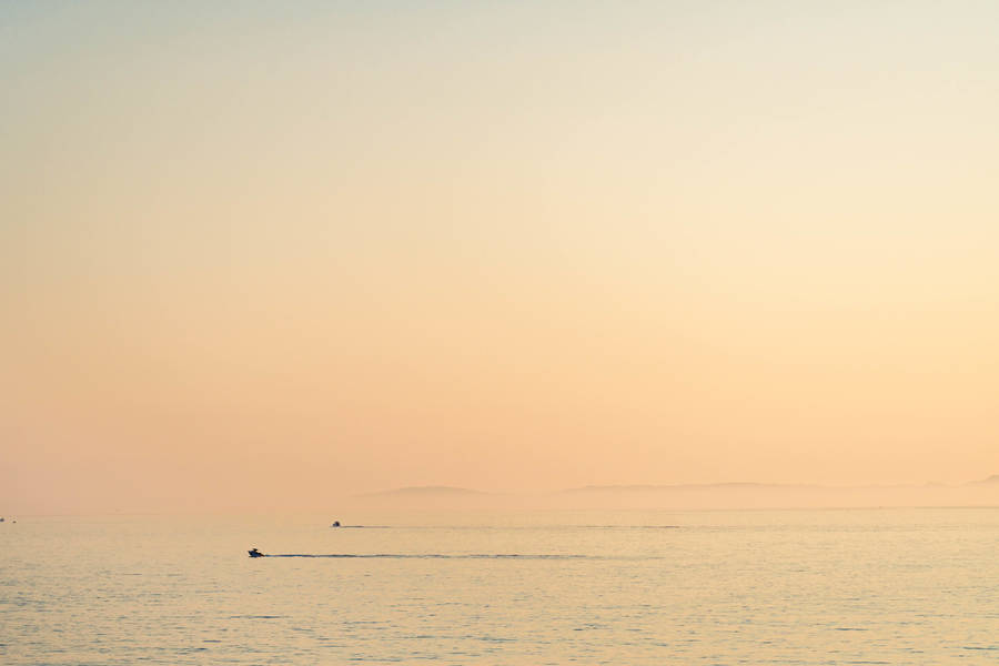 Boat Silhouette In The Horizon Wallpaper