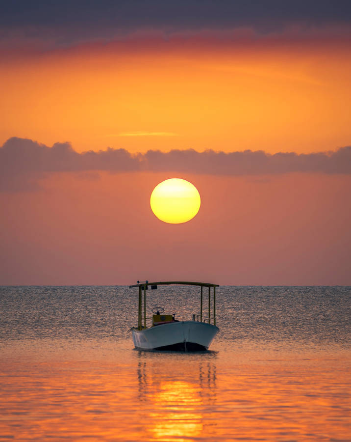 Boat With A Sun In The Horizon Wallpaper