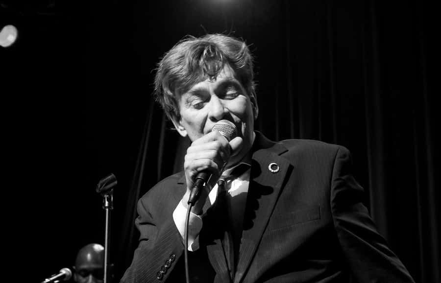 Bobby Caldwell Performing Live At A Concert Wallpaper