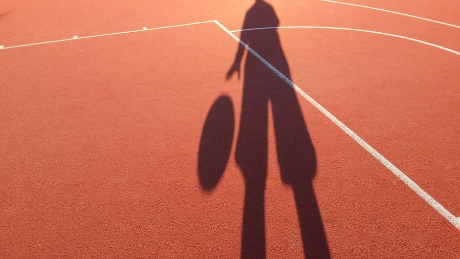 Boy Shadow In A Basketball Court Wallpaper