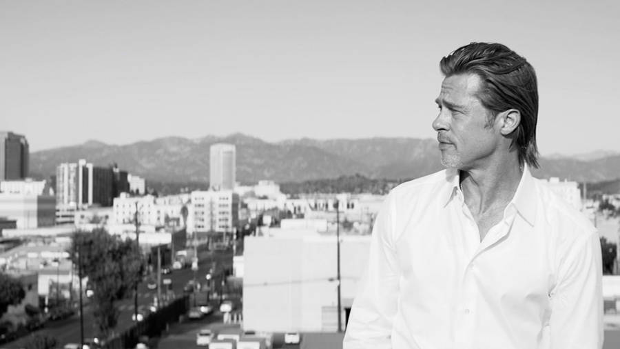 Brad Pitt Wearing A Brioni Polo Wallpaper