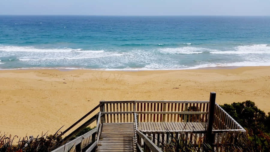 Breathtaking Sunset Over The Lush Landscape Of Warrnambool Wallpaper