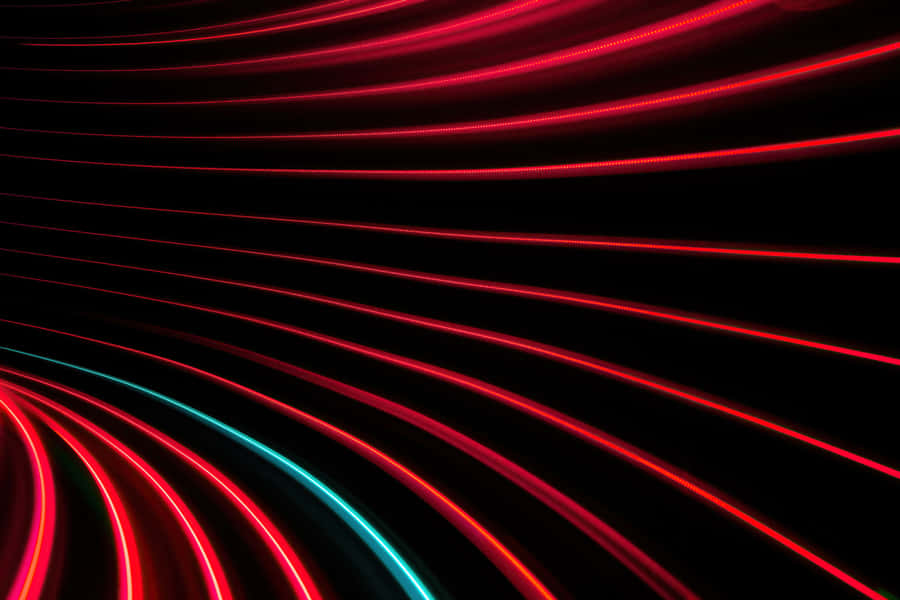 Bright Light Red Across A Reflective Surface Wallpaper