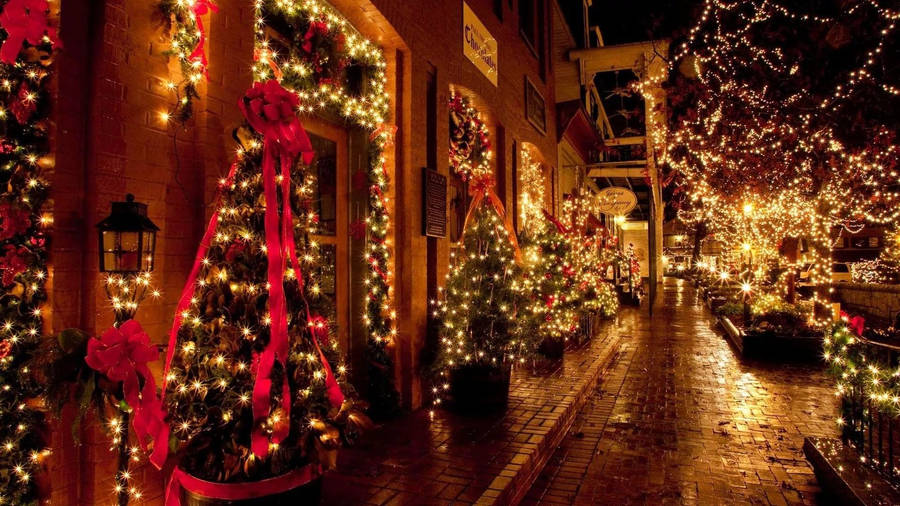 Brightly Lit Alley In Festive Christmas Lights Wallpaper