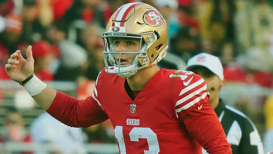 Brock Purdy49ers Quarterback Action Shot Wallpaper