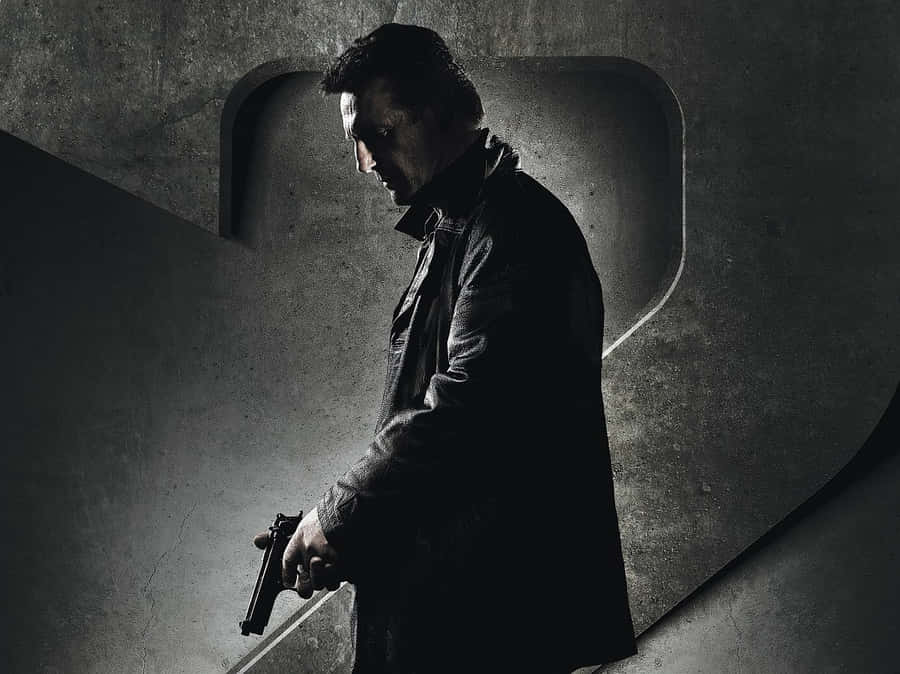 Brooding_ Figure_with_ Gun Wallpaper