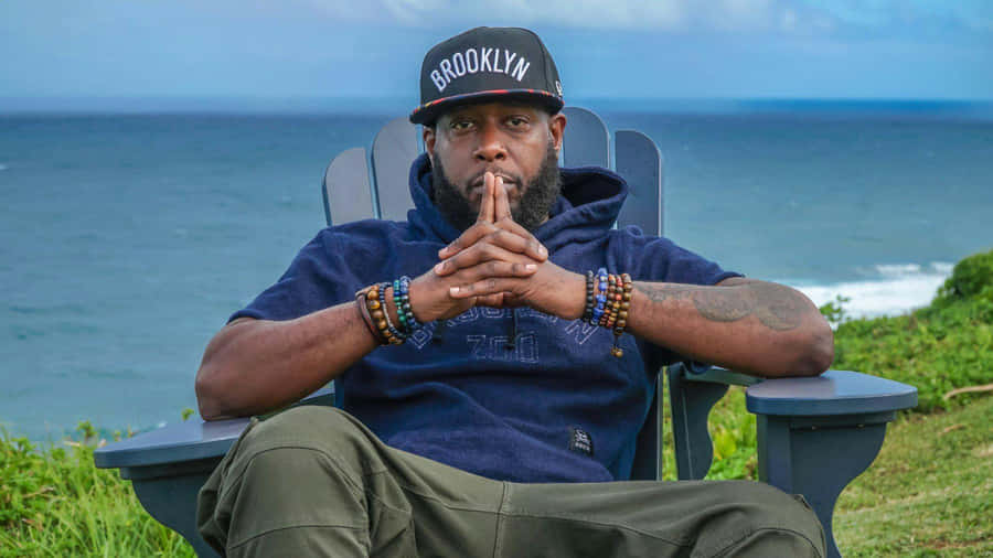 Brooklyn Hat Man Seaside Contemplation Wallpaper