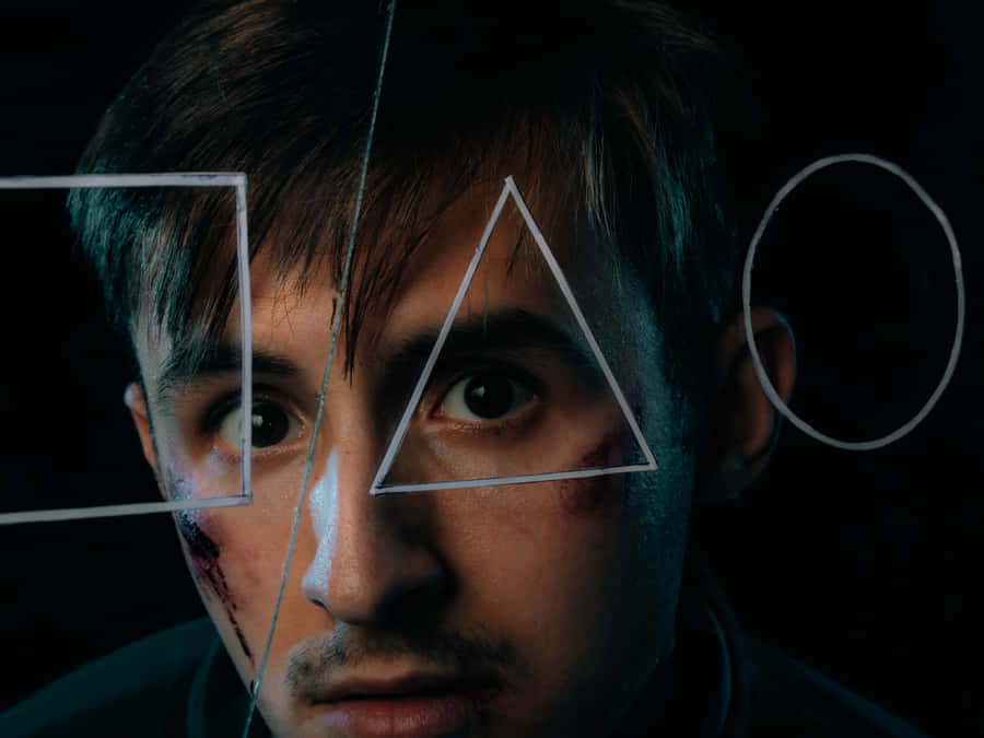 Bruised Man Looking Through Triangle Wallpaper