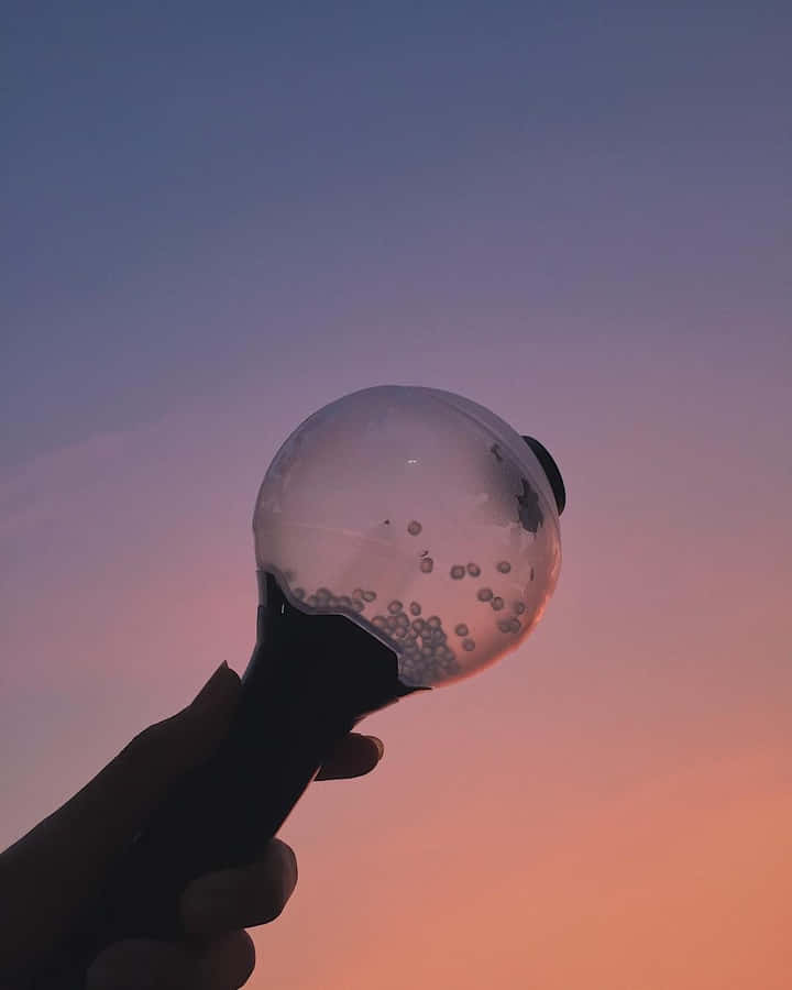 Bts Army Bomb: The Official Light Stick In Action Wallpaper