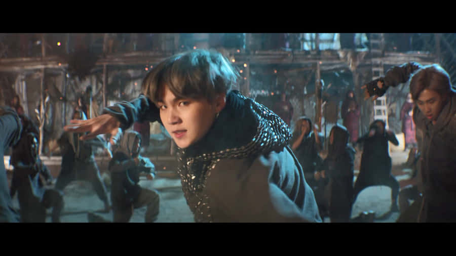 Bts Members In An Energetic Performance From Their Music Video Wallpaper