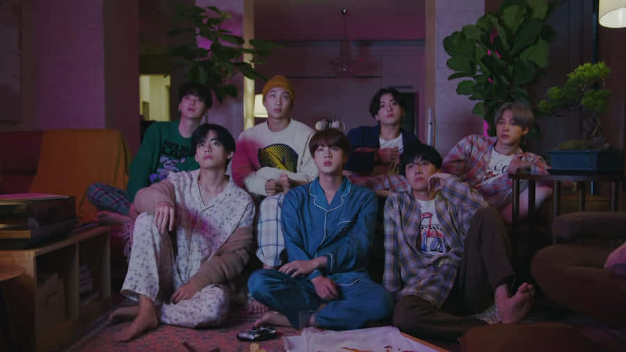 Bts Performing In An Energetic Music Video Wallpaper