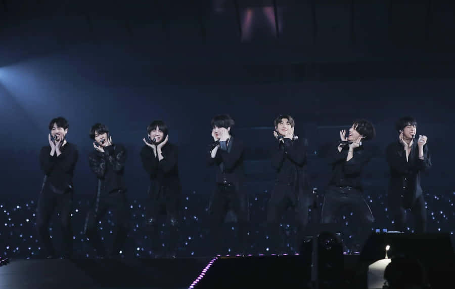 Bts Performing On Stage Wallpaper