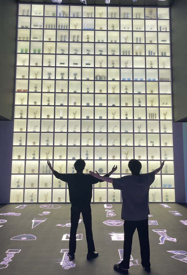 Bts Posing With Their Endorsement Product Wallpaper