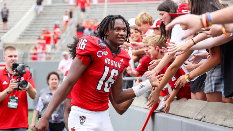 C J Bailey Football Player Interaction Wallpaper