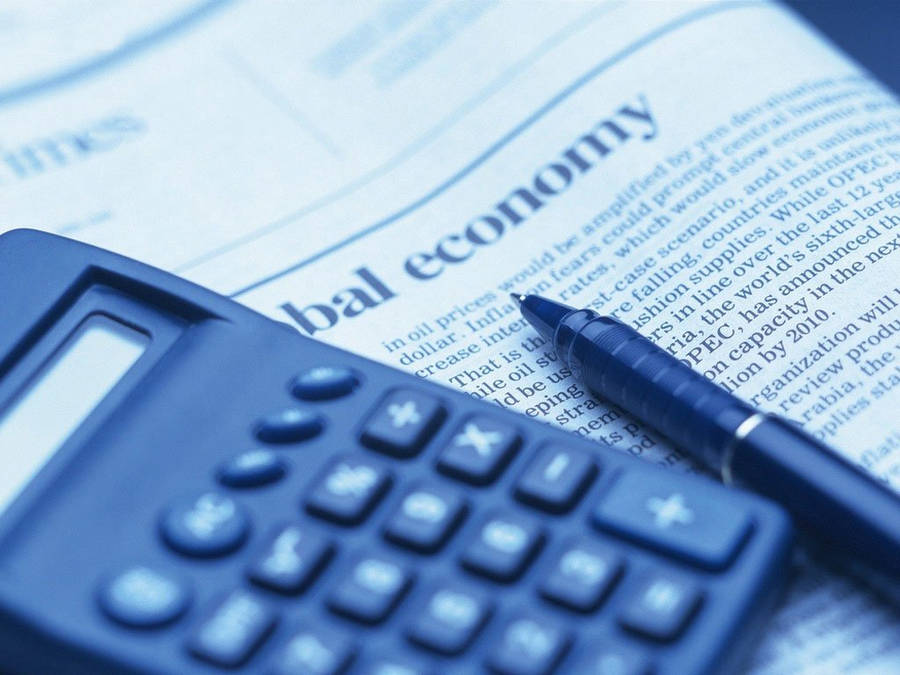 Calculator On Newspaper Wallpaper