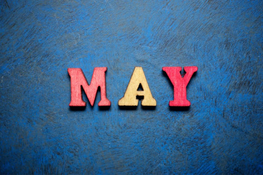 Calm River Surrounded By Lush Green Fields Wallpaper