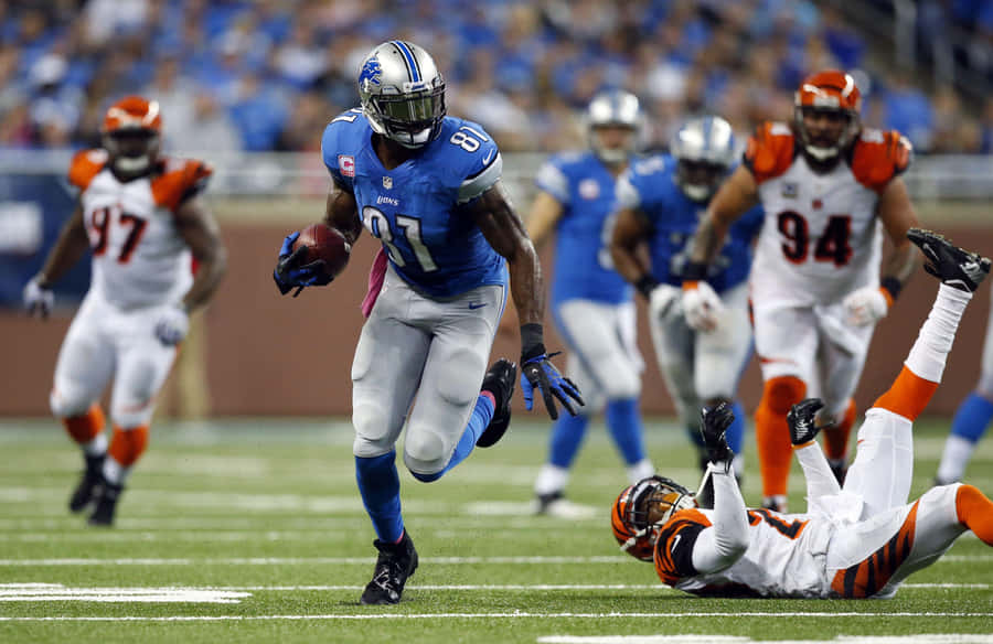 Calvin Johnson Evading Tackle During Game Wallpaper