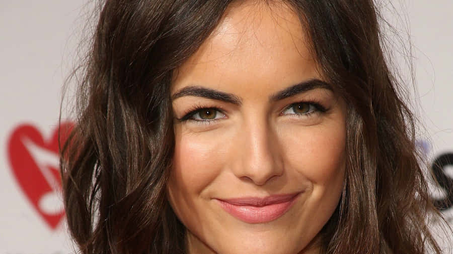 Camilla Belle Posing Elegantly In A Semi-formal Outfit Wallpaper