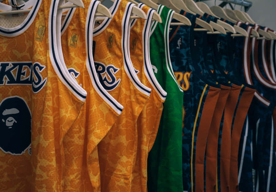 Caption: A Dynamic Collage Of Nba Basketball Jerseys. Wallpaper