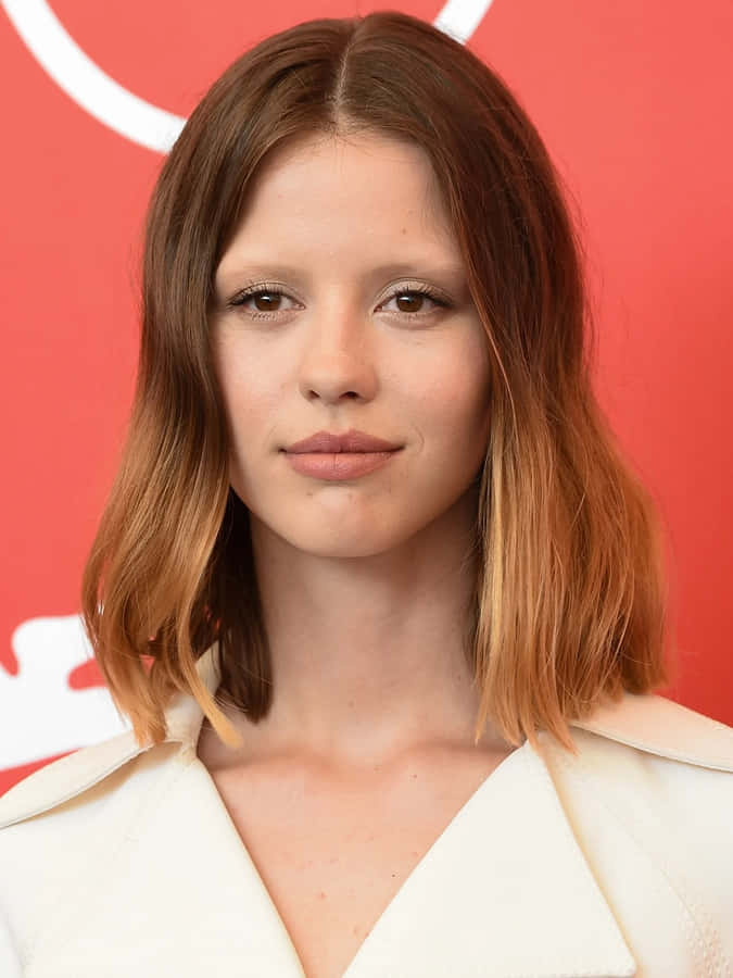 Caption: Actress Mia Goth Radiates Beauty In A Candid Photo. Wallpaper