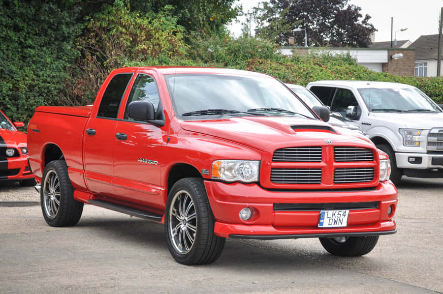Caption: Agile And Powerful Dodge Ram In Action Wallpaper