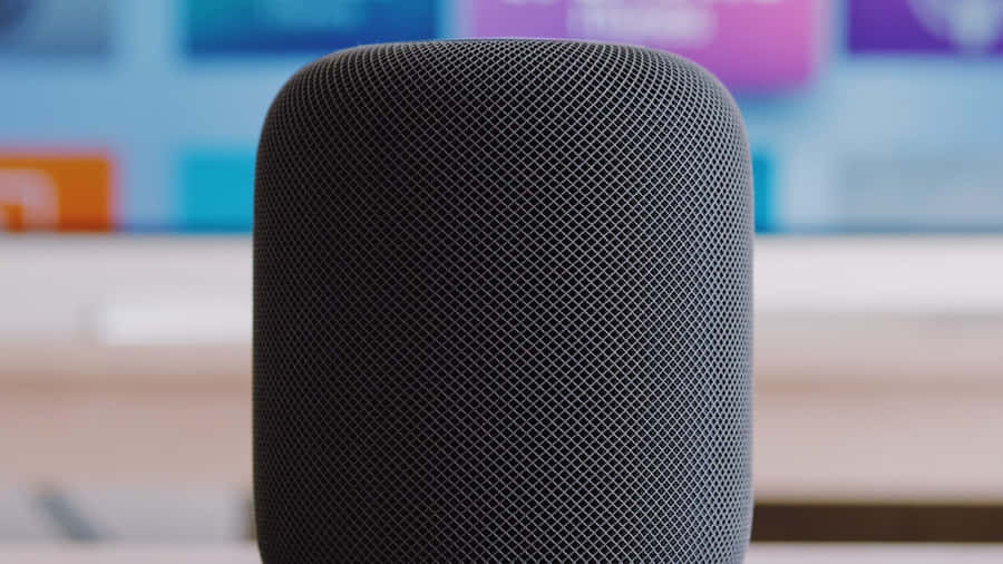 Caption: Apple Homepod On A Wooden Table Wallpaper