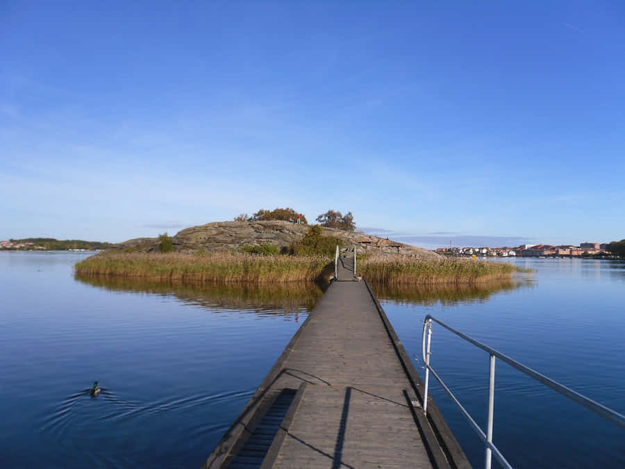 Caption: Breathtaking Sunset At Karlskrona Waterfront Wallpaper