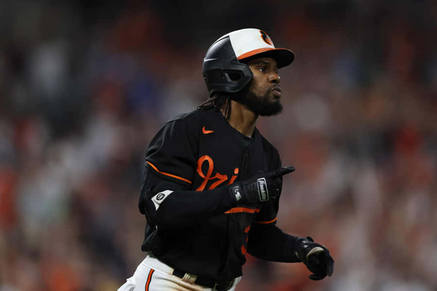 Caption: Cedric Mullins In Action On The Baseball Field Wallpaper