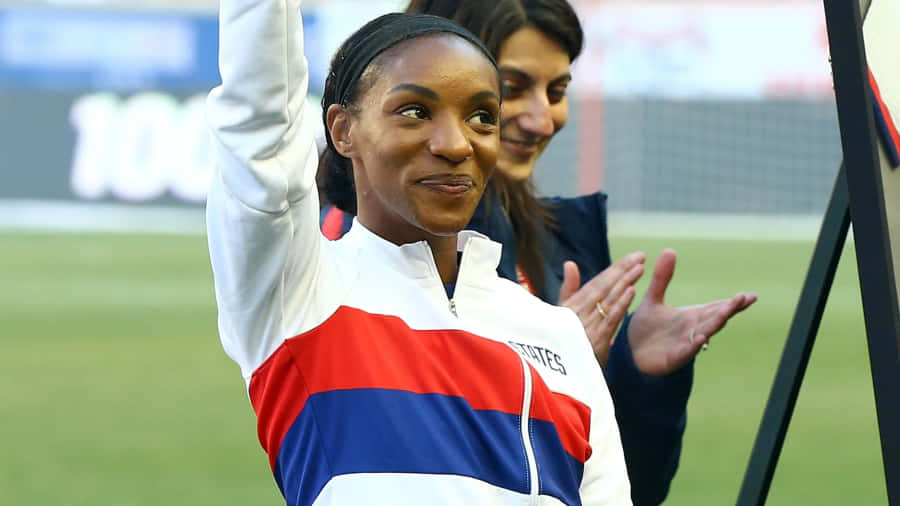Caption: Crystal Dunn - Champion Of The Soccer Field Wallpaper
