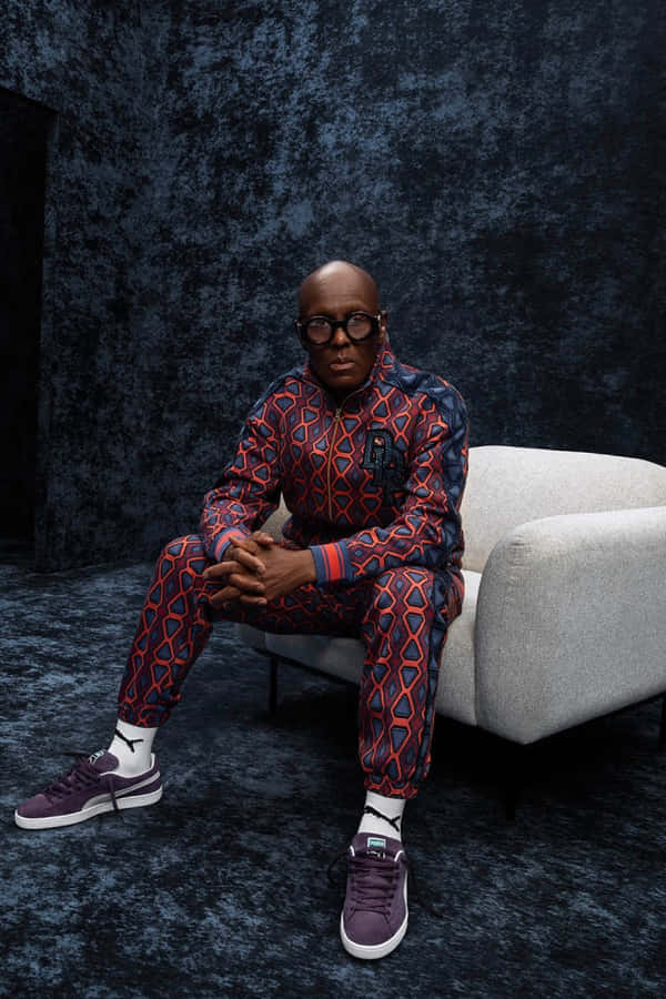 Caption: Dapper Dan Captured In A Stylish Retro Tracksuit. Wallpaper
