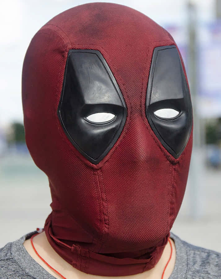 Caption: Deadpool's Iconic Red And Black Mask Wallpaper