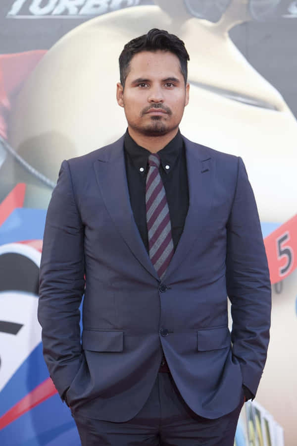 Caption: Distinguished Artist Michael Peña In A Captivating Portrait Wallpaper