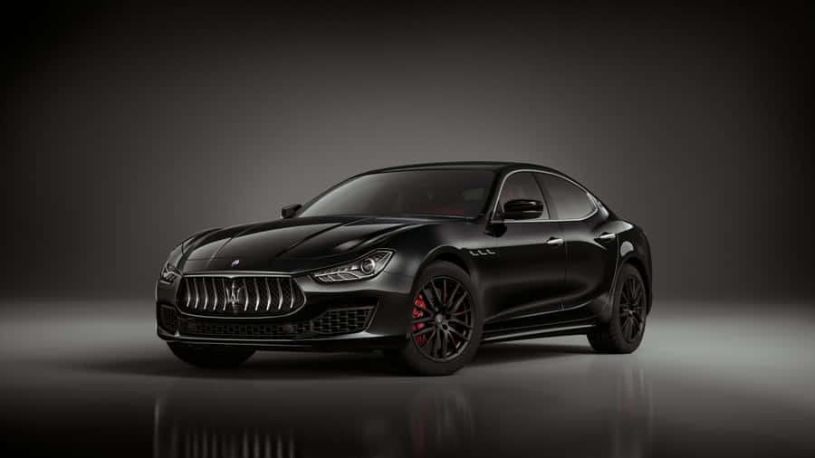 Caption: Elegance In Motion: The Majestic Maserati Ghibli Wallpaper